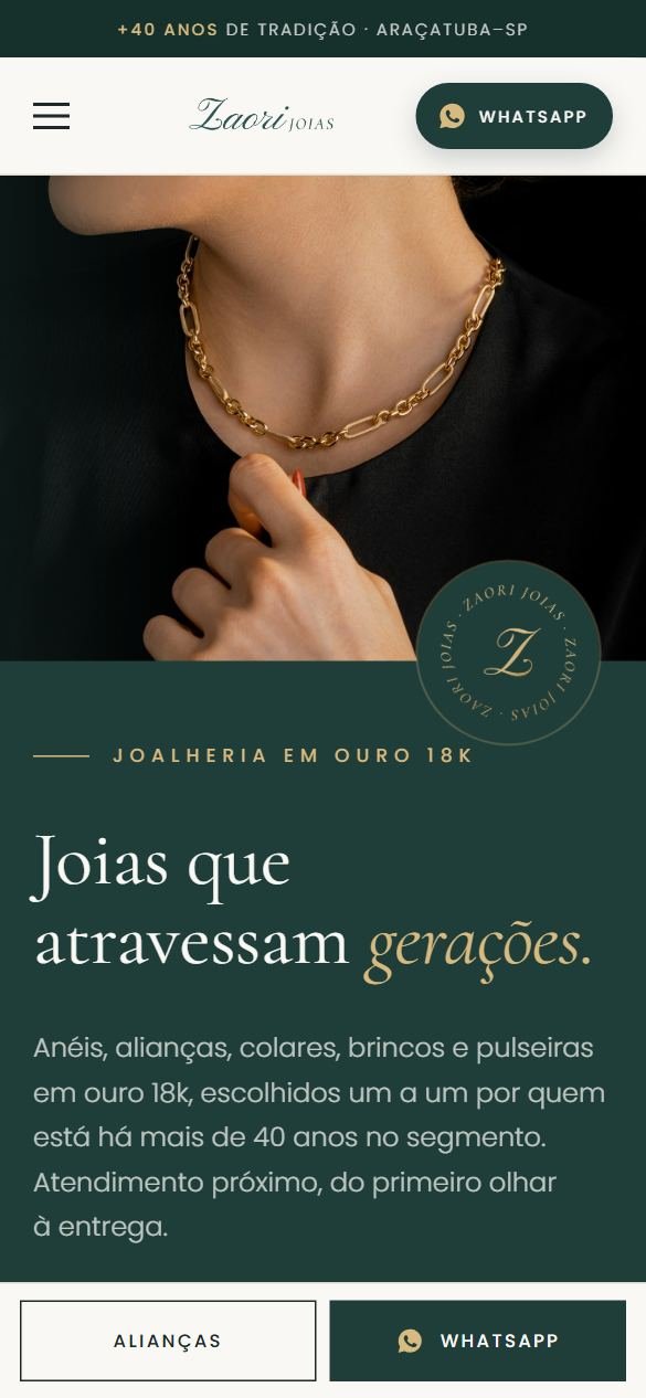 O site no celular, com o logo Zaori, o botão de WhatsApp no topo e a foto da corrente de ouro.